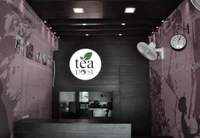 An interior part of the cafe with Tea Post logo in it.