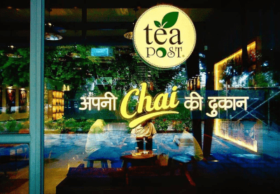 Logo of Apni Chai ki Dukaan on a glass frame of the cafe