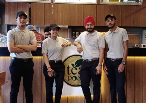 A group of people standing beside the counter