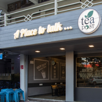 An outer part of a cafe with A Place to Talk logo on it