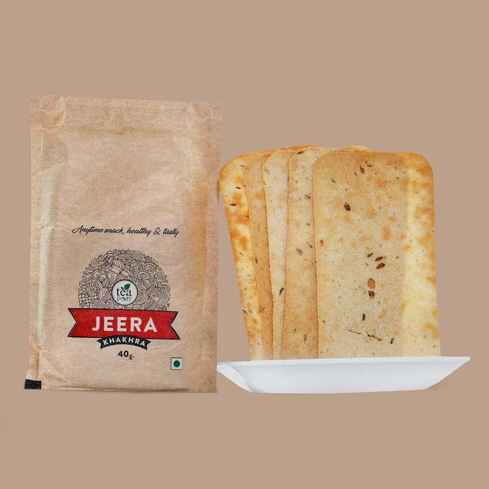 A packet of Jeera Khakhra of 40 gms along with three Jeera khakhra on a white plate