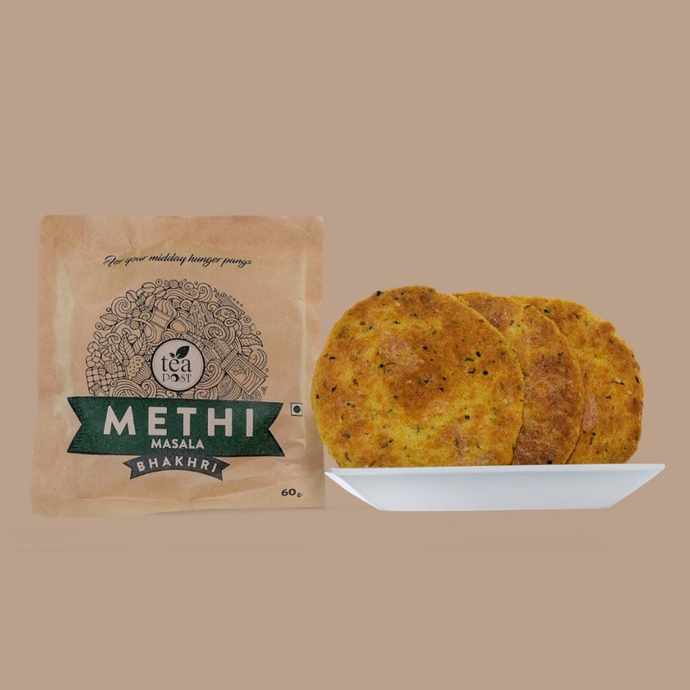 A packet of Methi Masala Bhakhri along with three units of Methi Masala Bhakhri on the plate